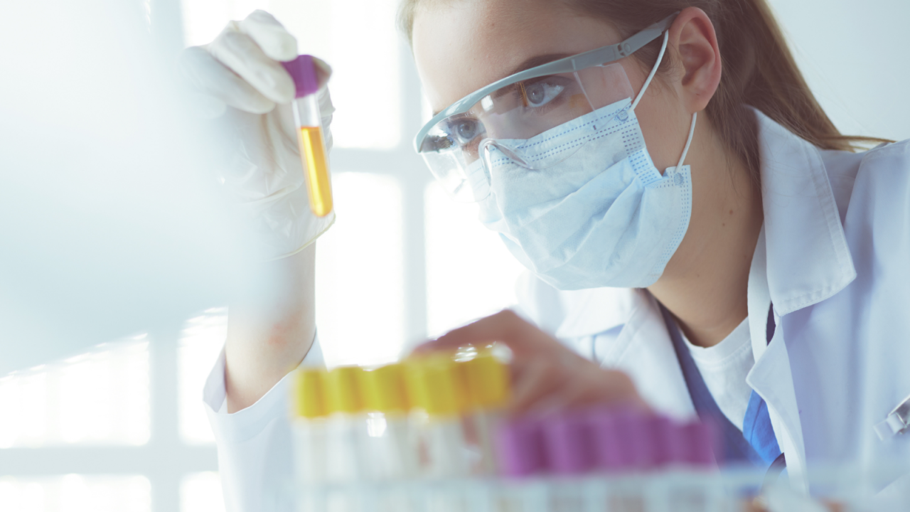 Female pharmaceutical scientist analyzing treatments to ensure product safety and determine rot causes for impurities.