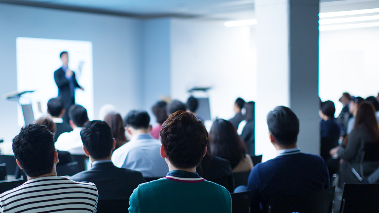 Out of focus instructor training audience on data analysis techniques to track and trace pharmaceuticals.