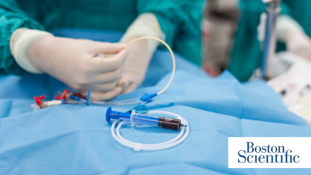 A doctor inserting a double lumen catheter into a patient with the Boston Scientific logo in the corner.