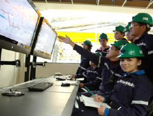  Technicians at the Saucito mine gathered around computer screens and taking notes